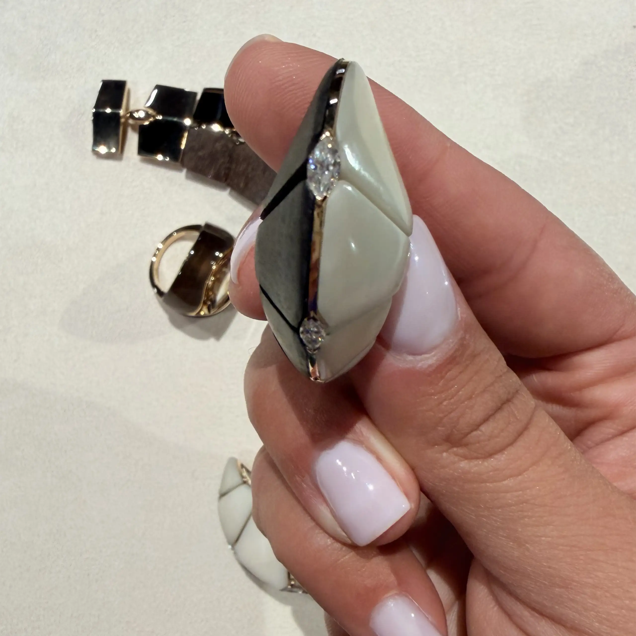 A marquise-cut diamond, set into the side of the jewel