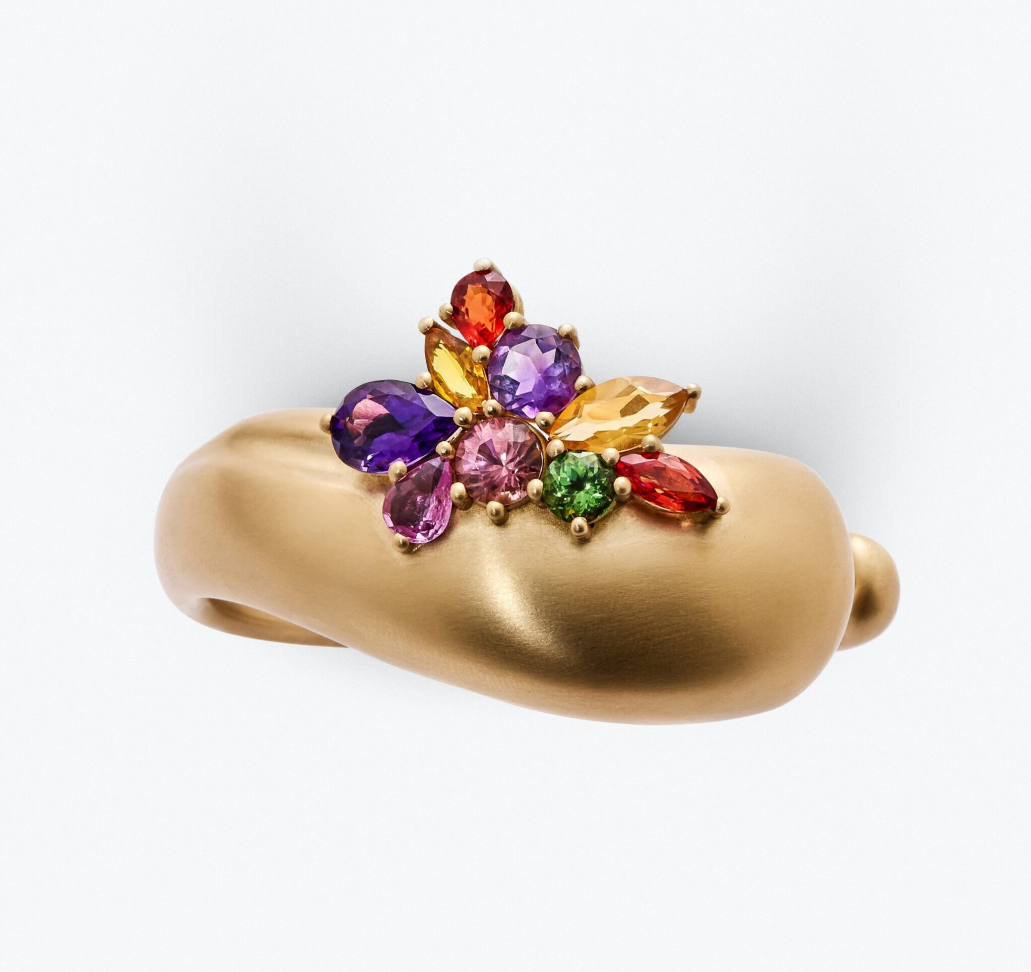 Hand-brushed gold and deliberately placed gemstones reflect Nada Ghazal’s signature approach in ECHOES