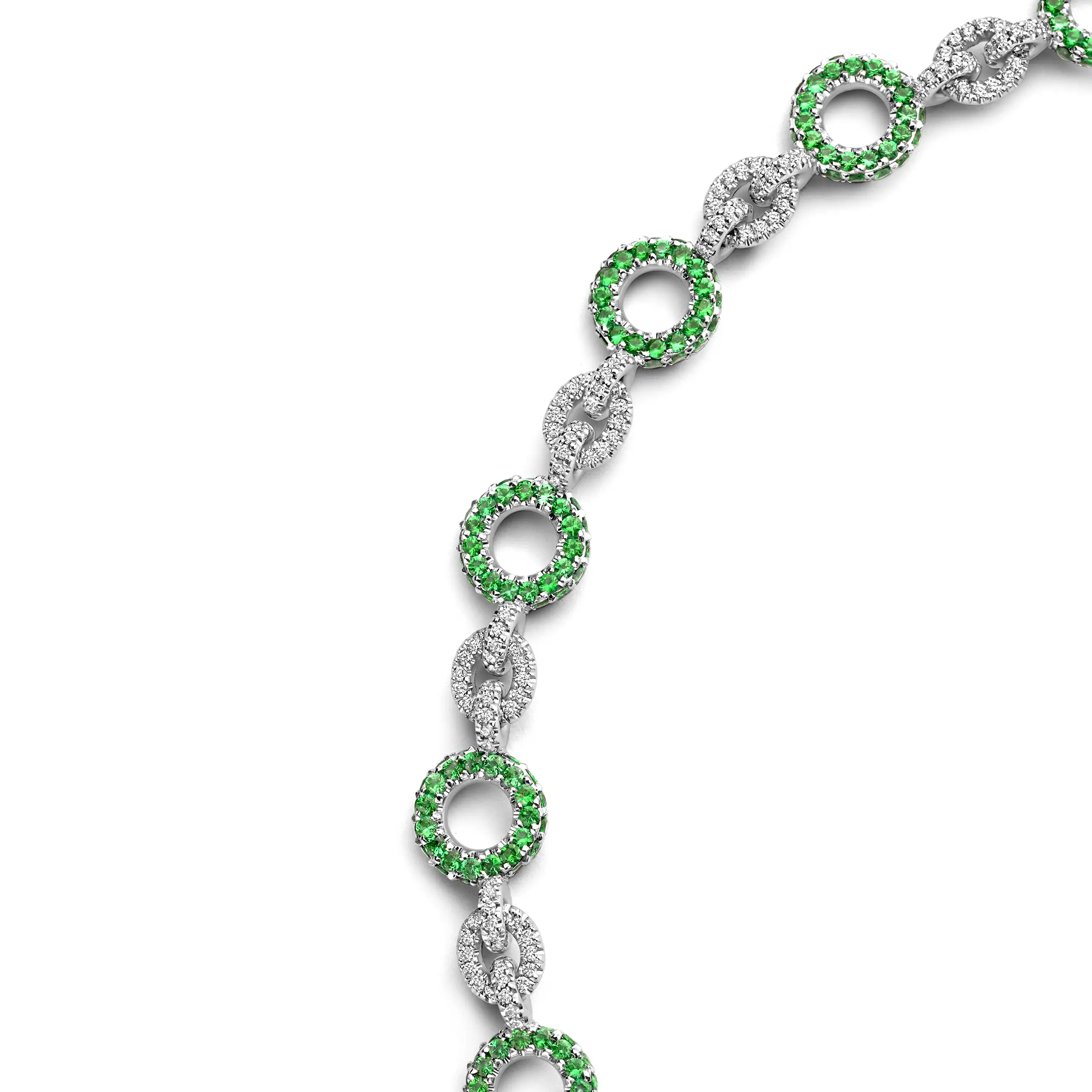Twenty-two circular links alternate emerald-set forms with diamond-set connections, creating the rhythm that gave Orbita its name