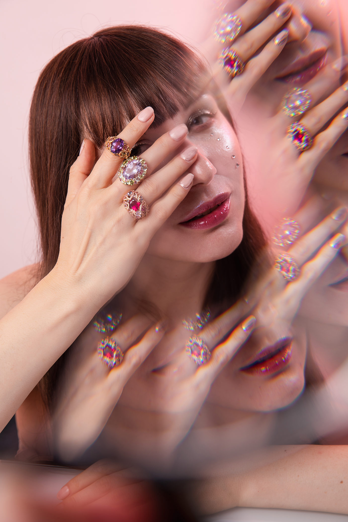 Cocktail rings by Isabelle Langlois, including a ring with amethyst, tsavorites and pink sapphires from the Plumage collection (top), an Emotion collection ring with a Rose de France amethyst, peridot, pink sapphire, tourmaline and tsavorite (middle), and a third ring with rubellite, diamonds, pink sapphires and iolites from the Shéhérazade collection (bottom).