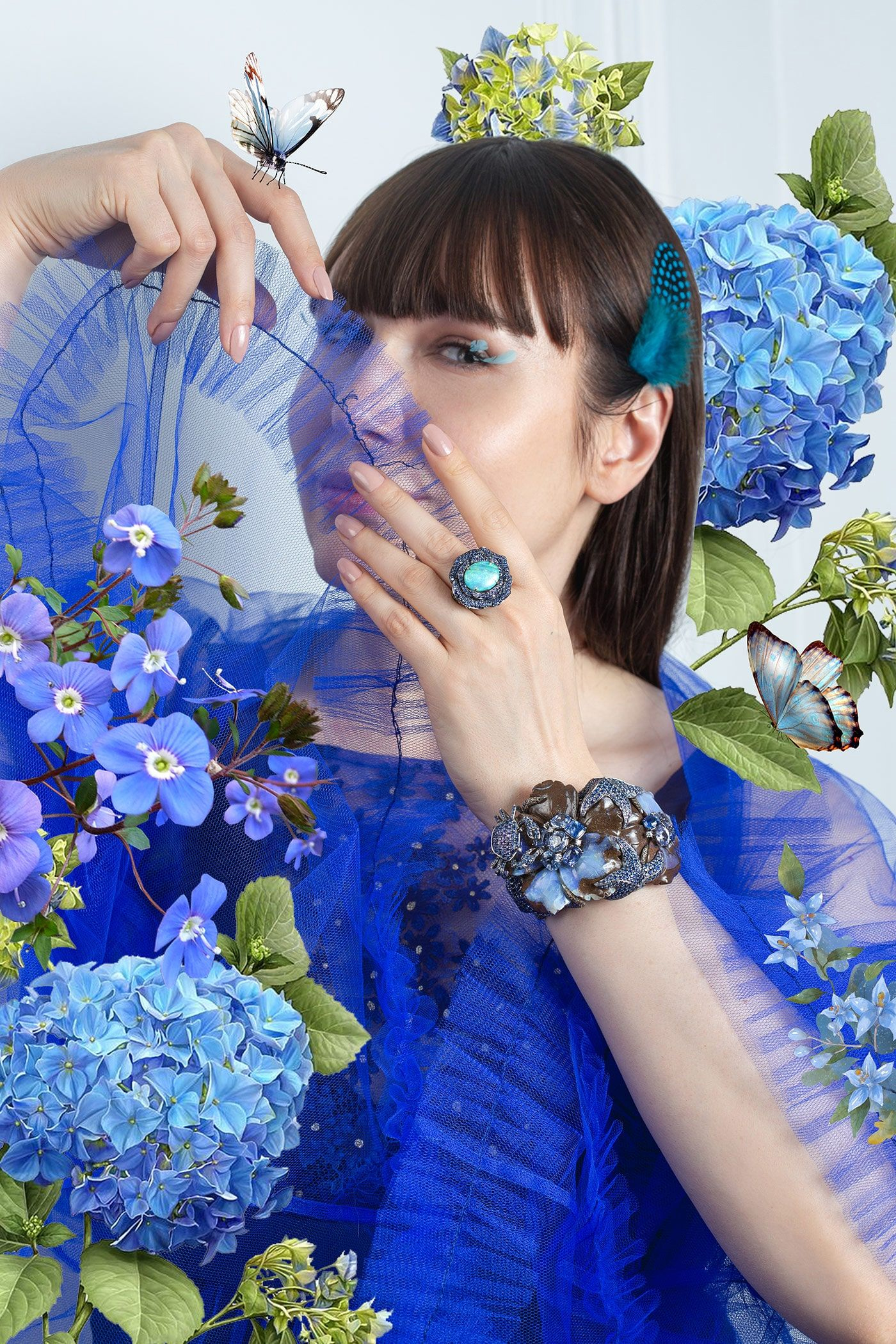 The opal ring and cuff bracelet are by Lydia Courteille. The dress is by Moira Cristescu.