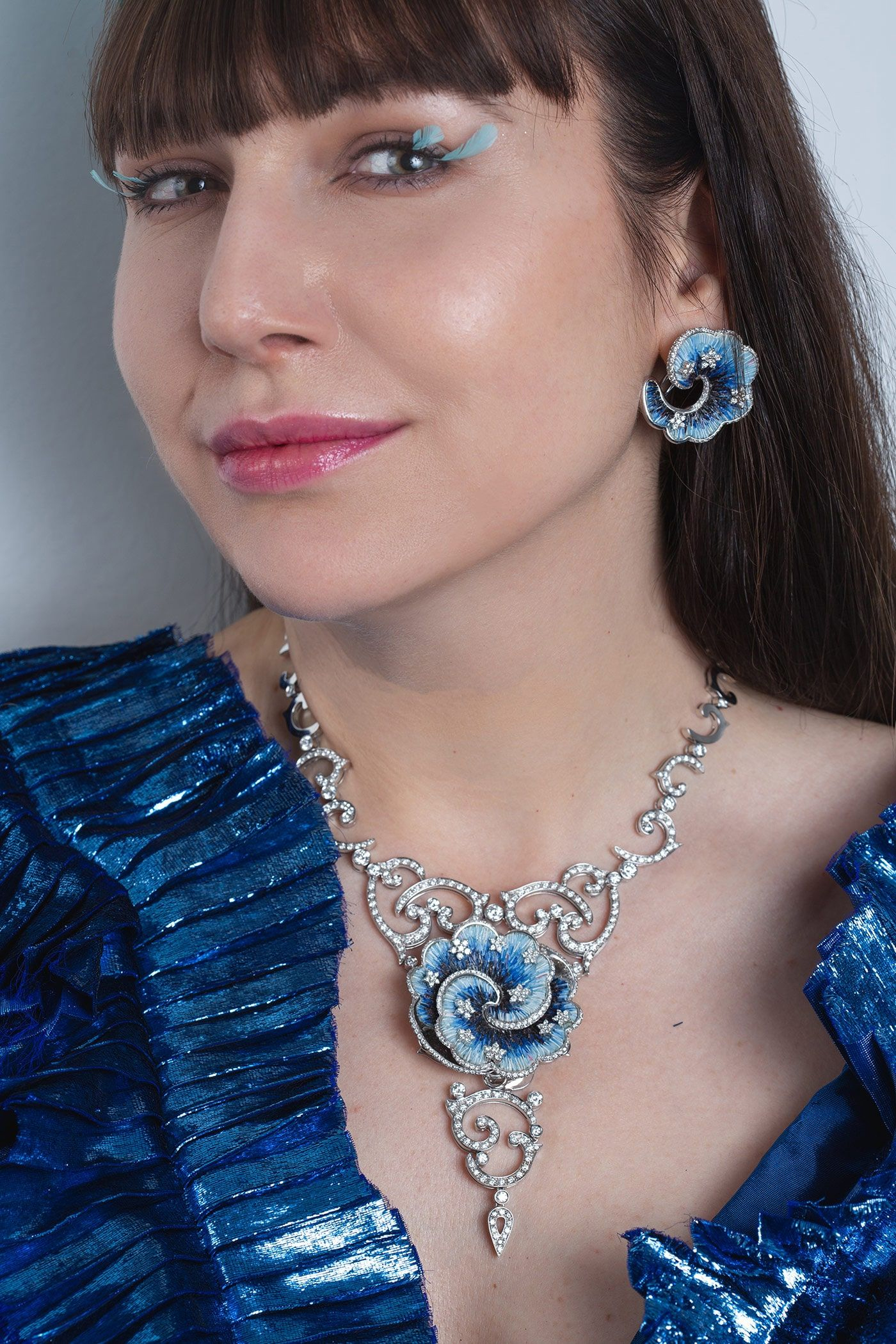 The micromosaic and diamond set is by SICIS. The dress is by Janina Juliee. The feather ornament is by Sandrine Bourg.